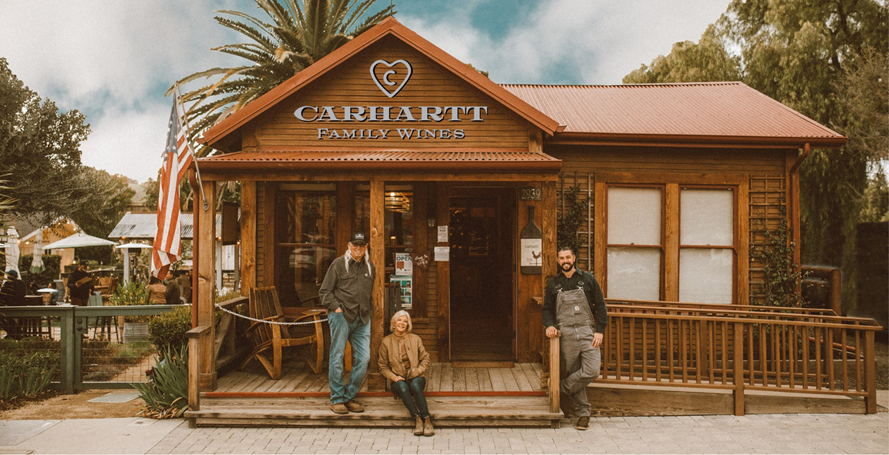 Mike, Brooke and Chase Carhartt outside Carhartt Cabin