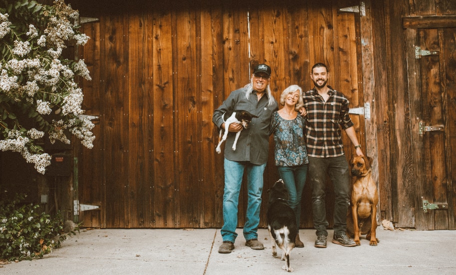 Mike, Brooke and Chase Carhartt with Ranch Dogs