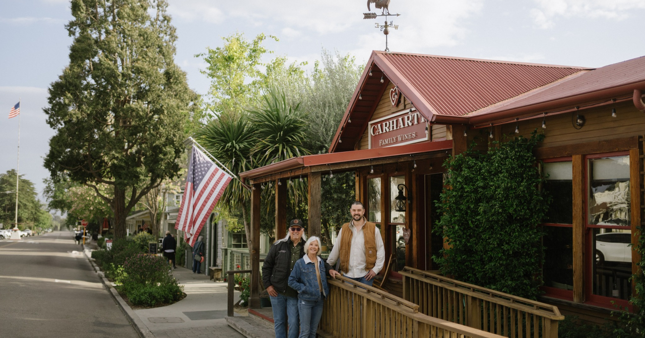 Three members of the Carhartt family standing in front of the Carhartt Family Wines tasting room in Los Olivos, California.