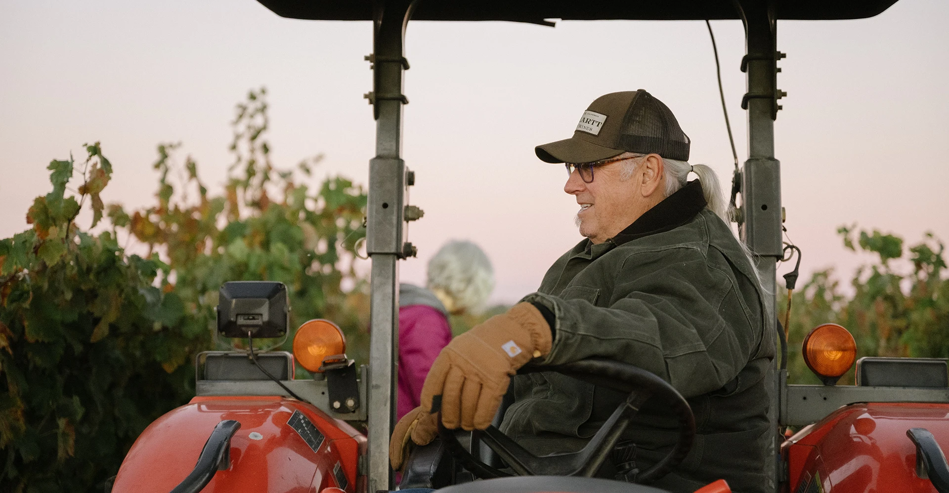 Mike driving the tractor through the vineyards