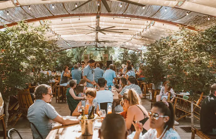 Guests on the back patio at Carhartt Family Wines, a stop worth building a Los Olivos weekend trip around